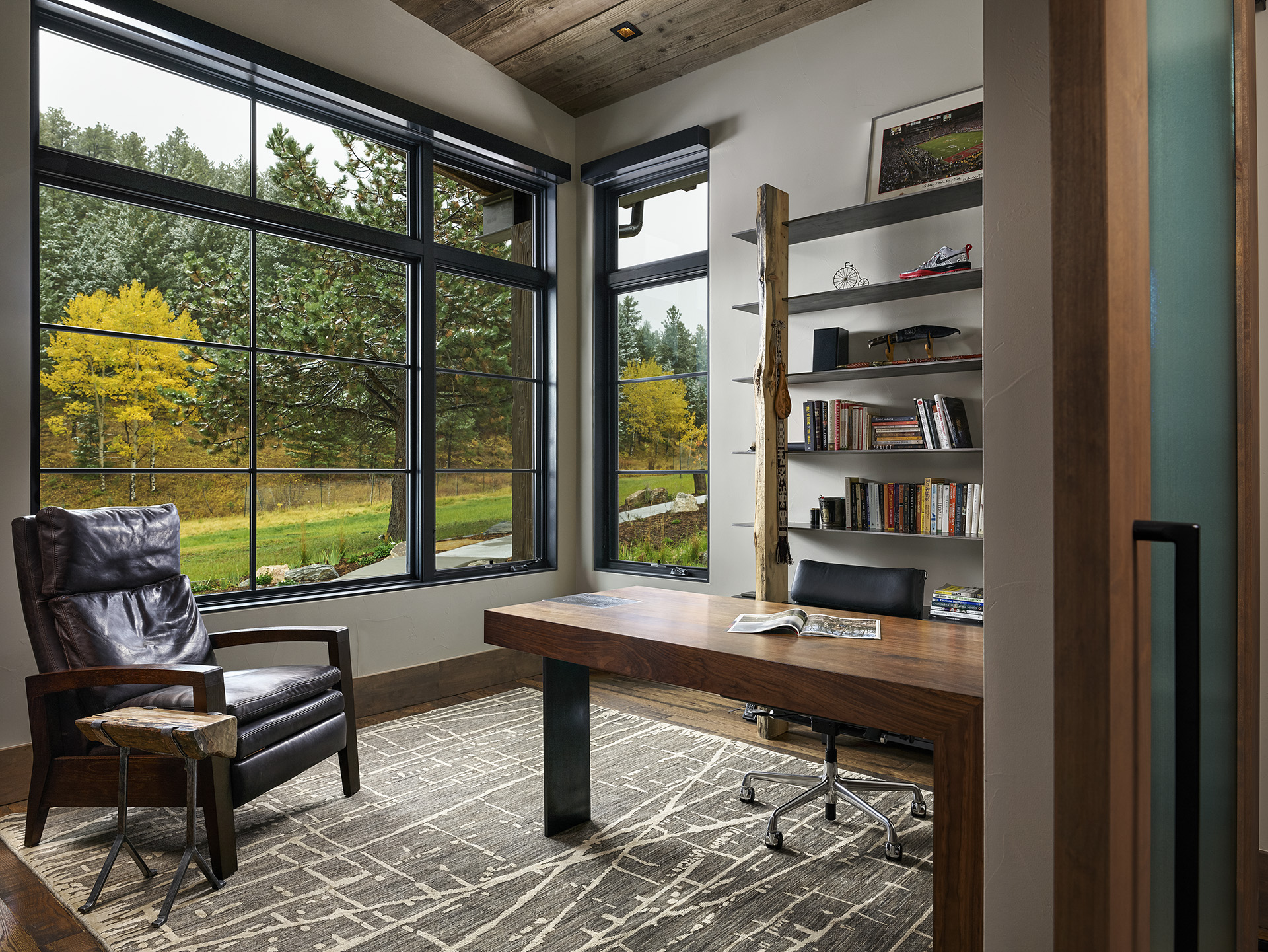Handlebar Ranch study with distressed wood floors and custom details