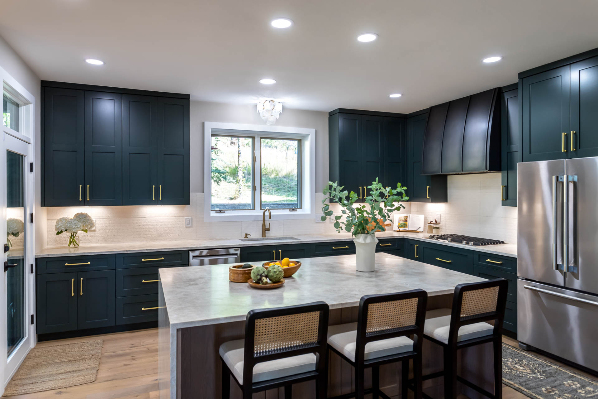 Bierstadt interior with hunter green cabinetry and white oak island