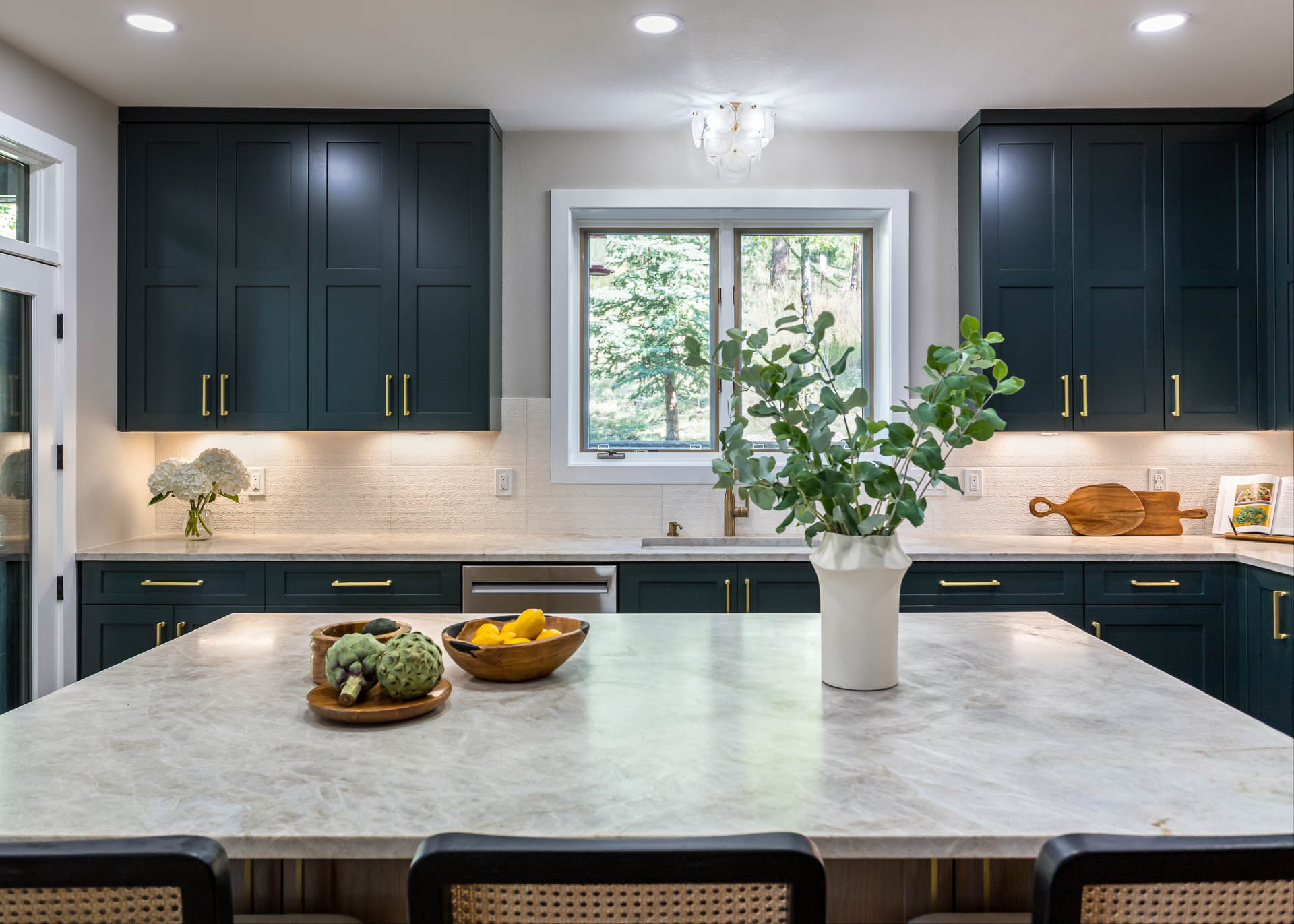 Bierstadt kitchen featuring custom steel hood and quartzite countertops