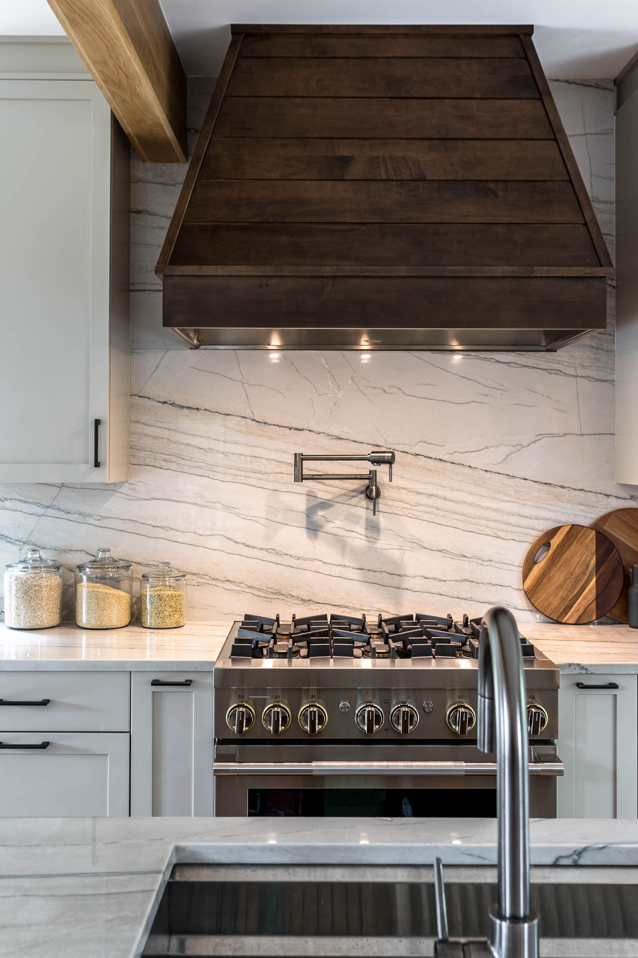 Tennyson kitchen with quartzite countertops and solid slab backsplash