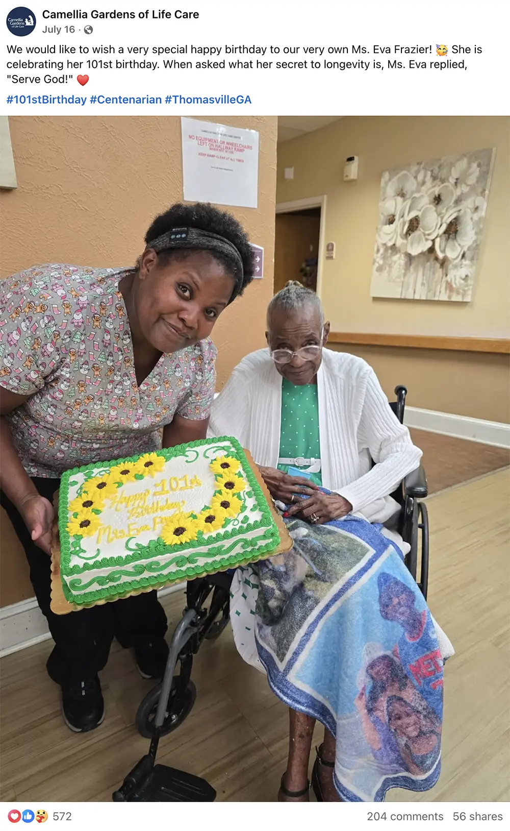 Camellia Gardens Facebook post celebrating a resident's 101st birthday with an associate holding a sunflower cake
