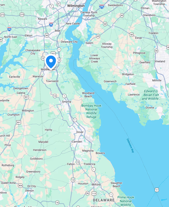 Map showing towns and highways around Delaware River including Newark, Middletown, Smyrna, and Bombay Hook National Wildlife Refuge.