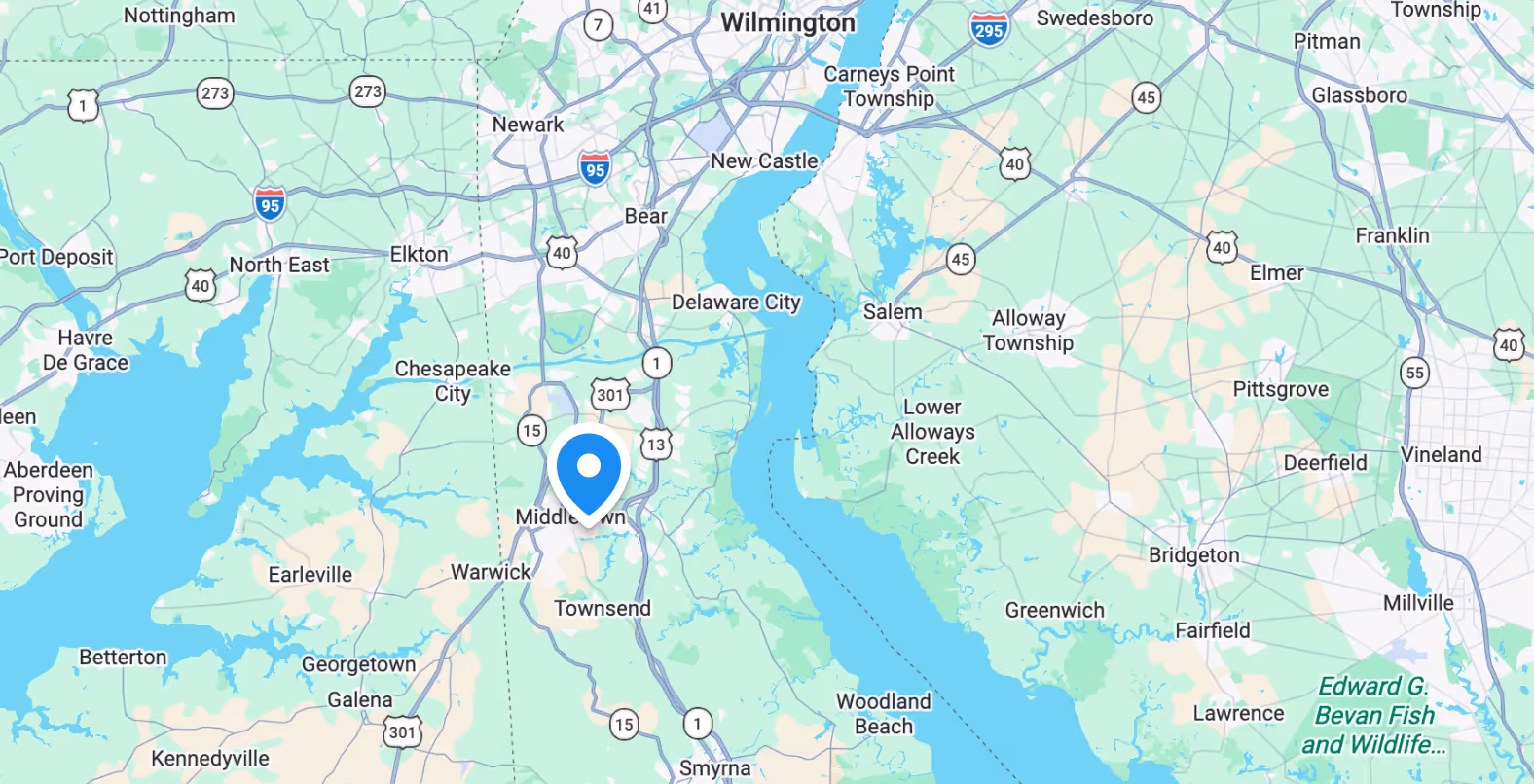 Map showing towns and highways around Delaware River including Newark, Middletown, Smyrna, and Bombay Hook National Wildlife Refuge.