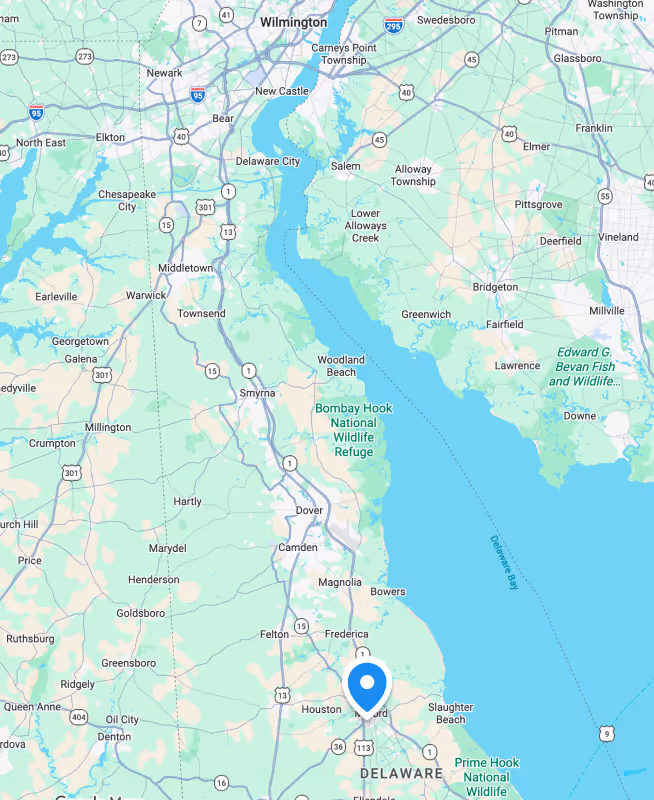 Map showing towns and highways around Delaware River including Newark, Middletown, Smyrna, and Bombay Hook National Wildlife Refuge.