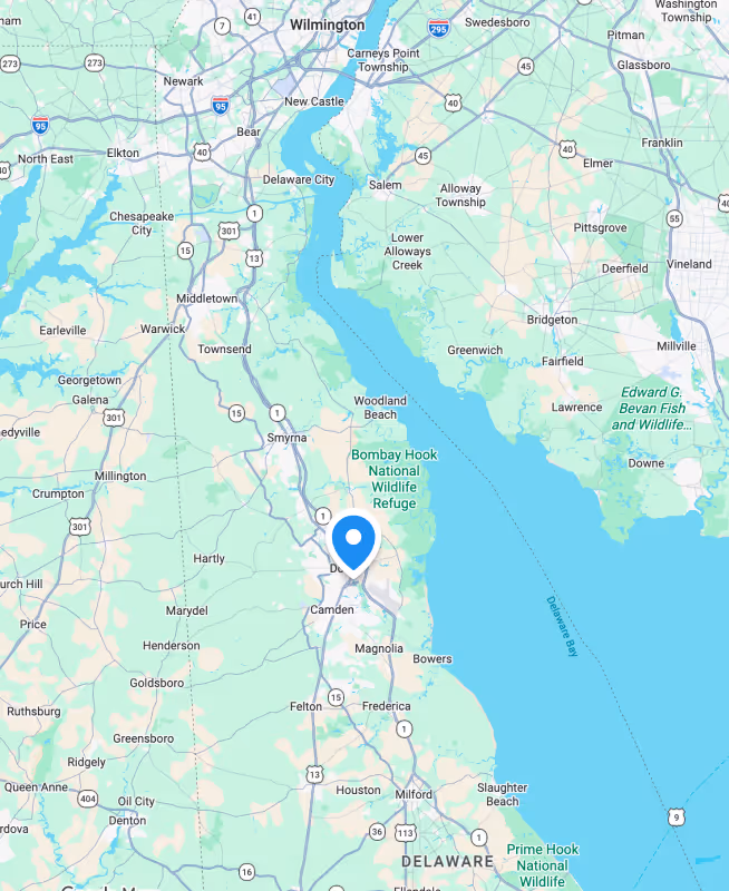 Map showing towns and highways around Delaware River including Newark, Middletown, Smyrna, and Bombay Hook National Wildlife Refuge.