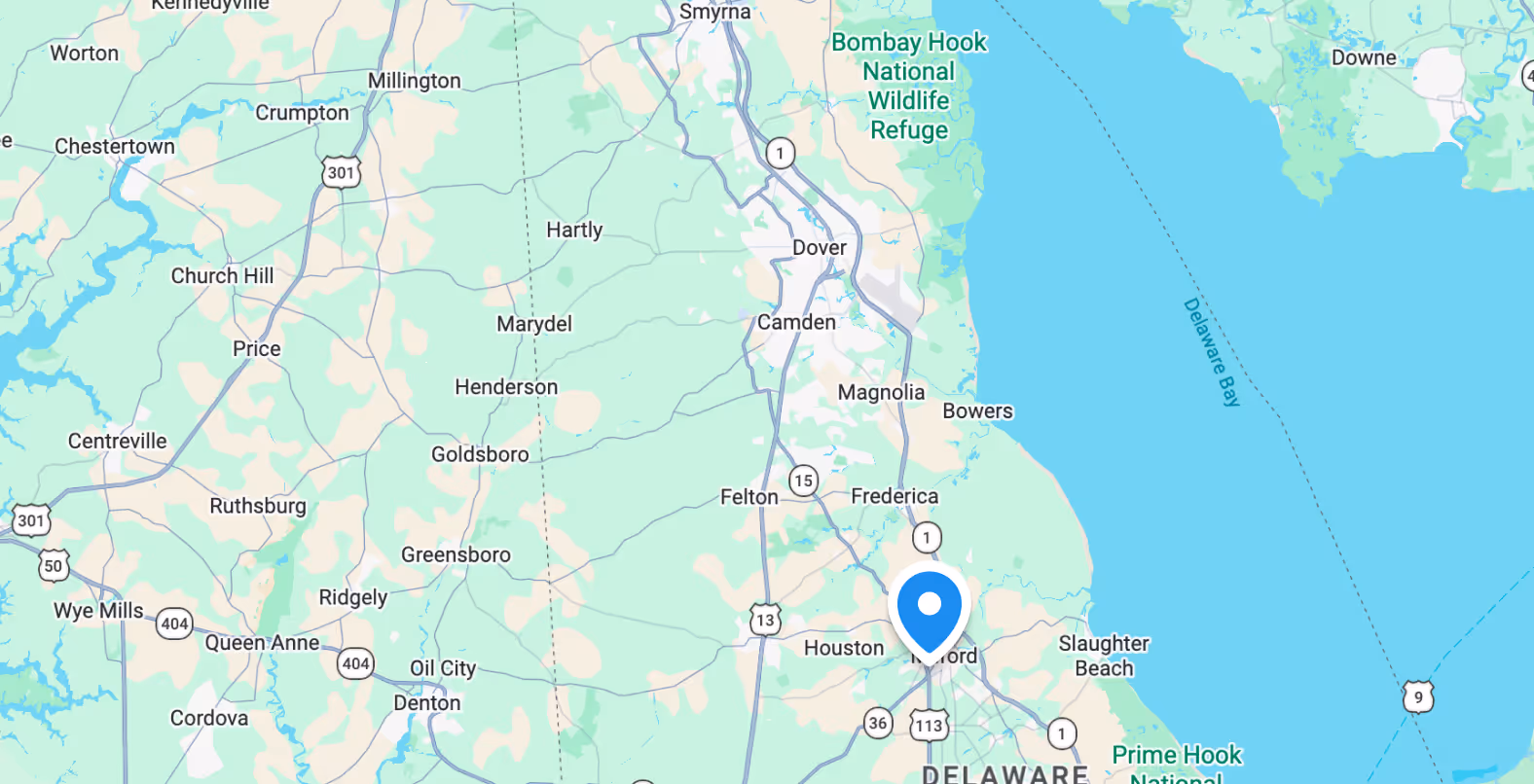 Map showing towns and highways around Delaware River including Newark, Middletown, Smyrna, and Bombay Hook National Wildlife Refuge.