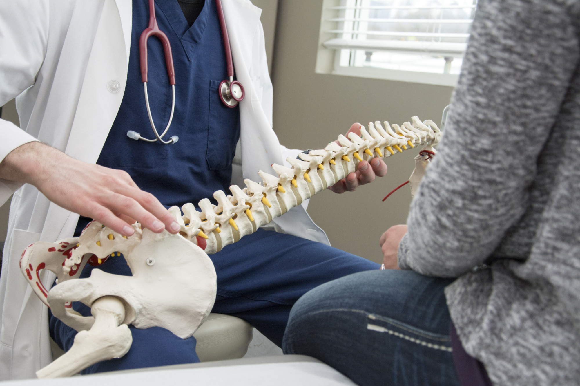 Patient discussing spinal decompression therapy for chronic back pain.