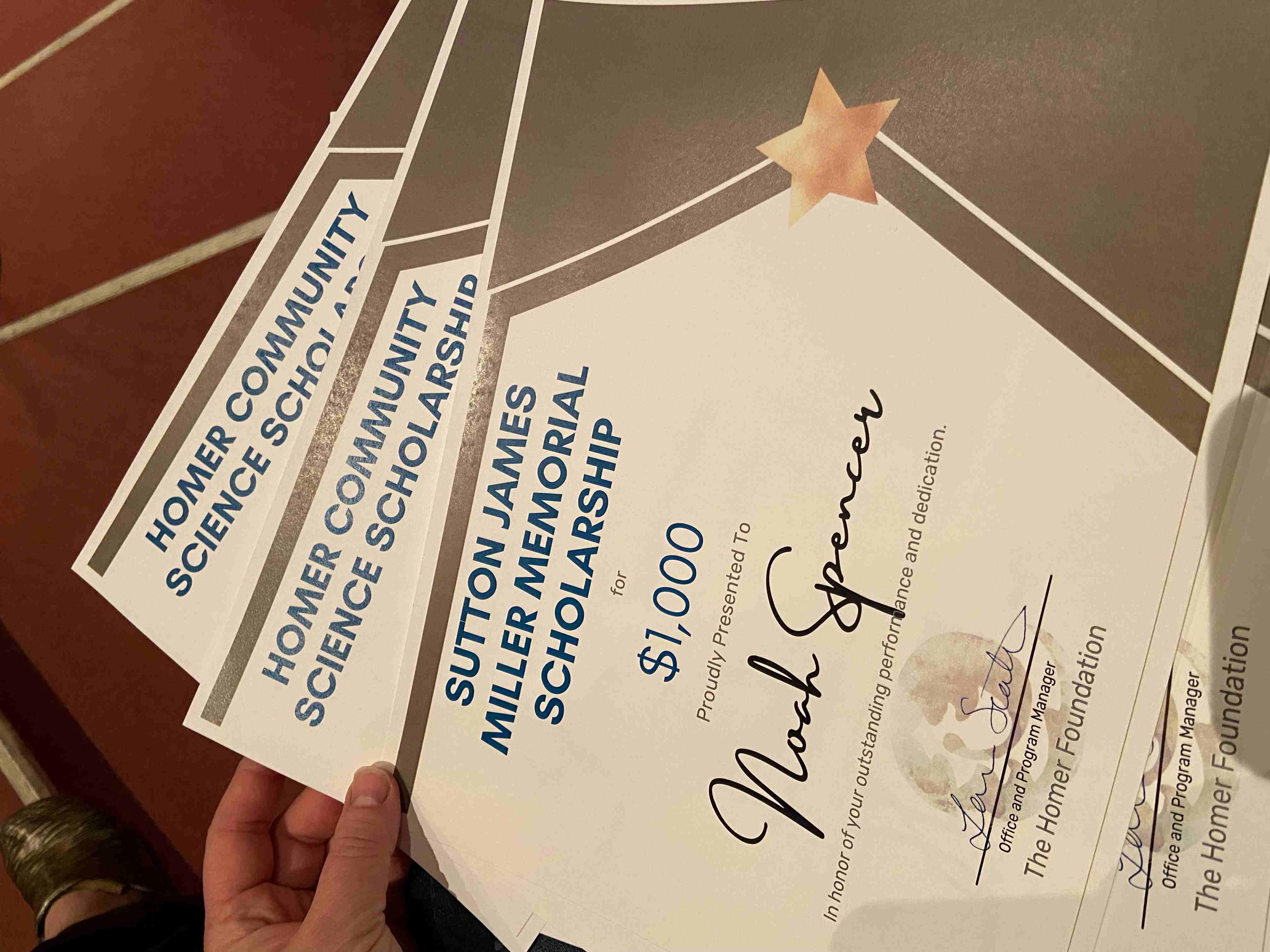 Image of scholarship award certificates. 