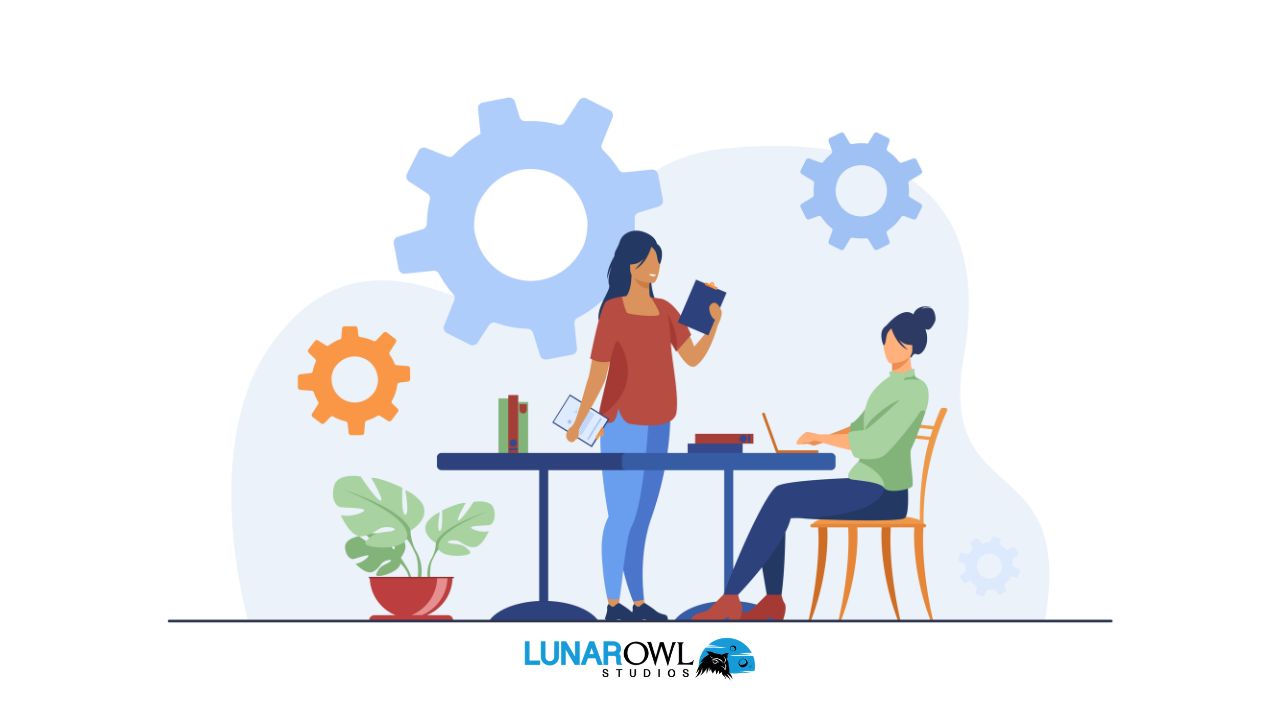Flat vector illustration of a table with two individuals, a laptop, and a book, suggesting a collaborative work or study session.