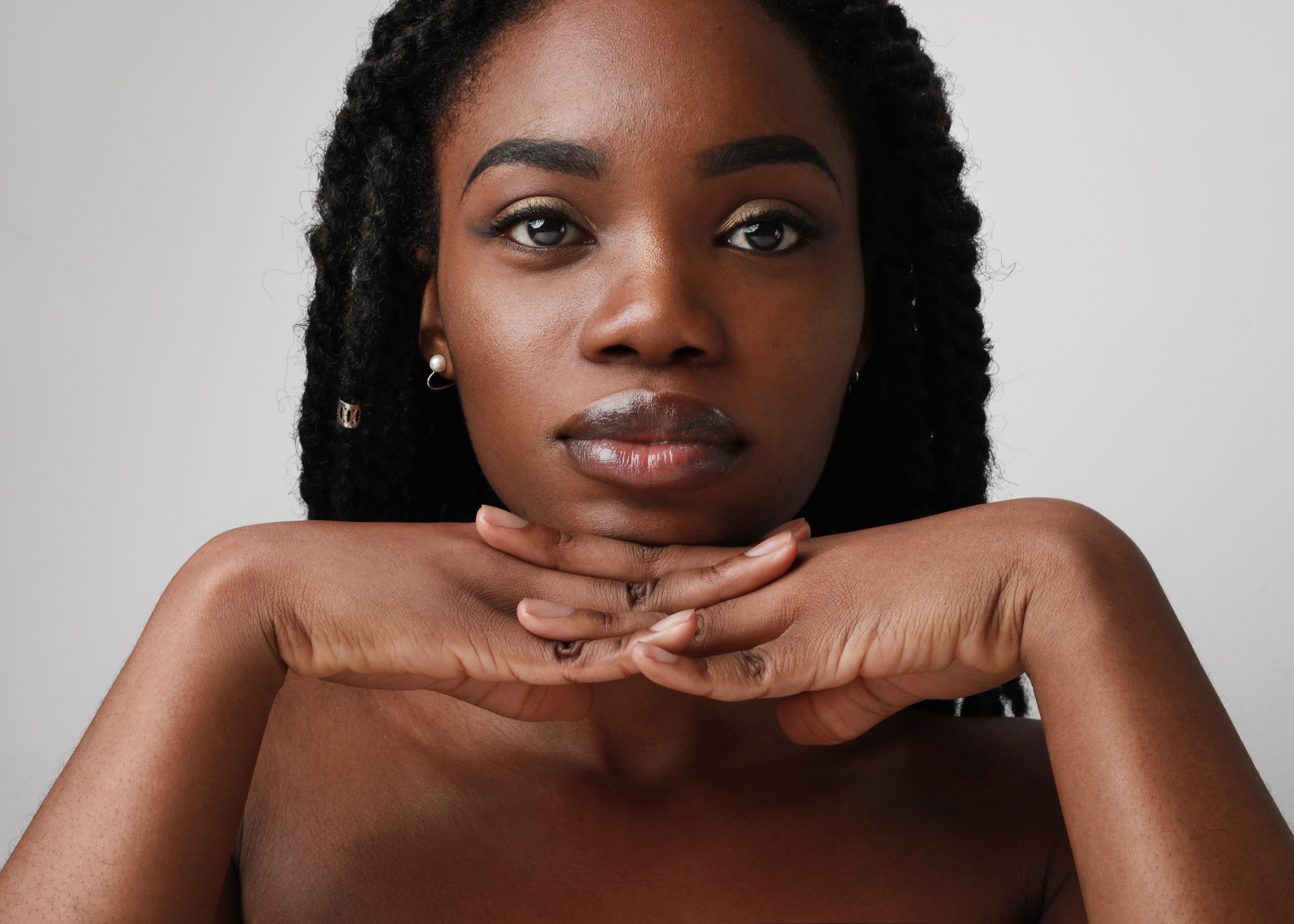 black woman putting chin on hands