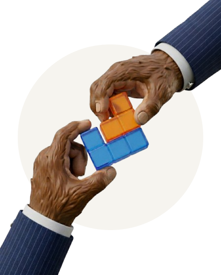 Two monkey hands, wearing blue pinstripe suit sleeves, connecting orange and blue Tetris-like puzzle pieces.