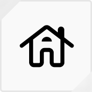 Black house icon with a chimney on a light gray rounded square background.