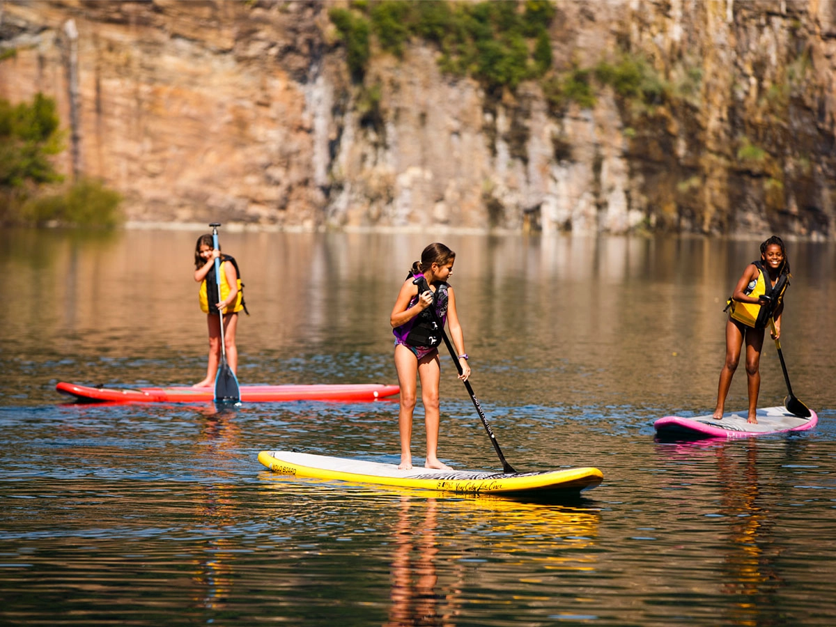 Children on paddle boards at the Fort Dickerson Quarry 