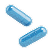 Two blue capsule pills with shadow on white background.