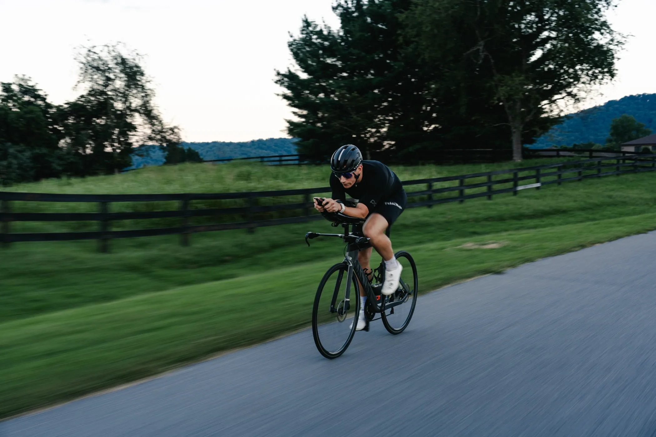 Triathlete riding a Canyon Speedmax along a country road