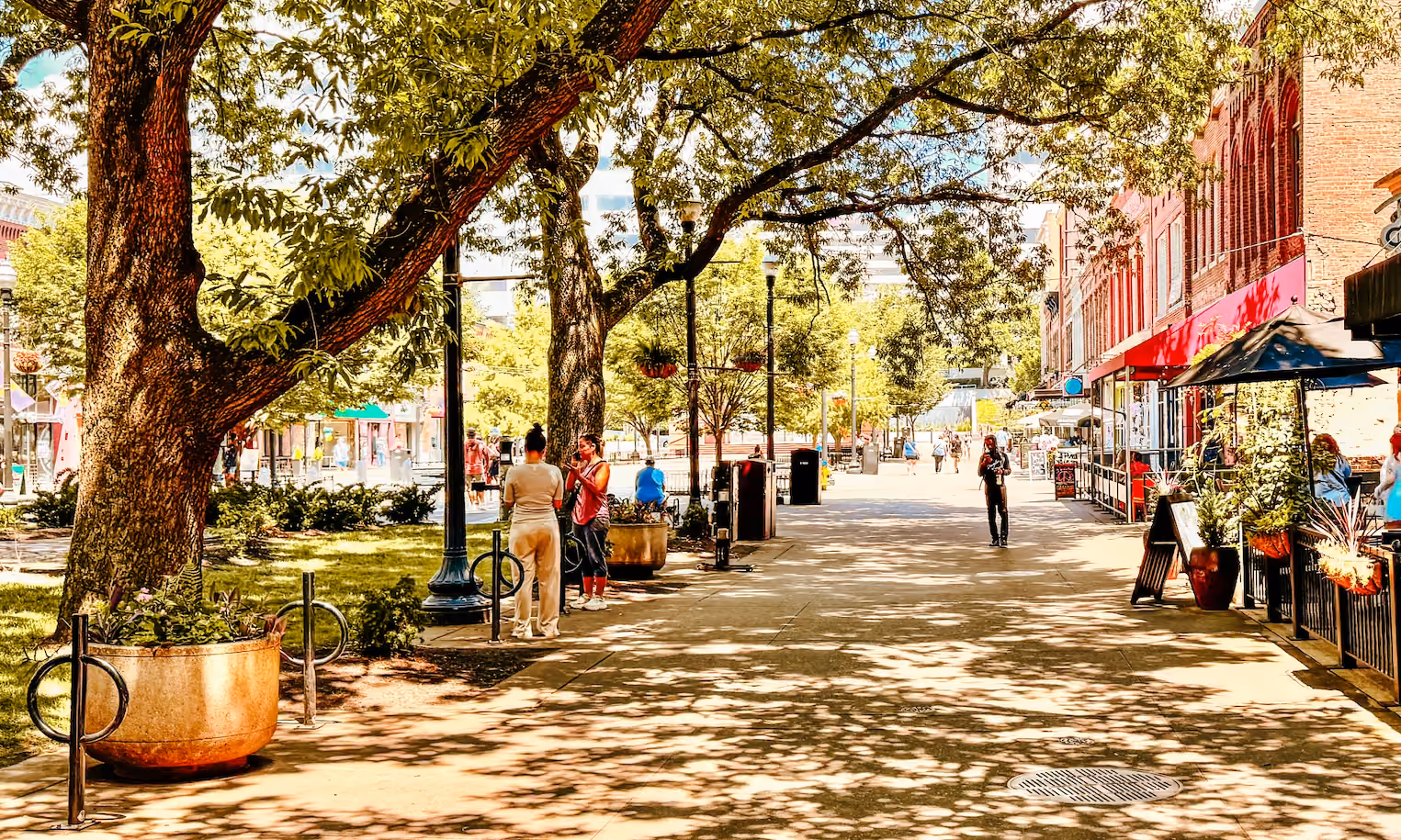 People gathered in market square on a sunny day