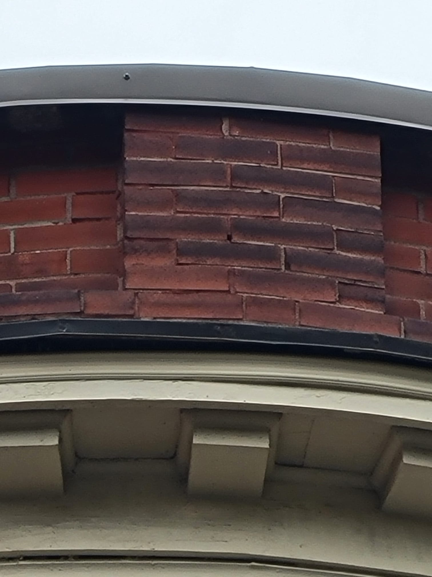 Cracked mortar joints and brick deterioration caused by water penetration