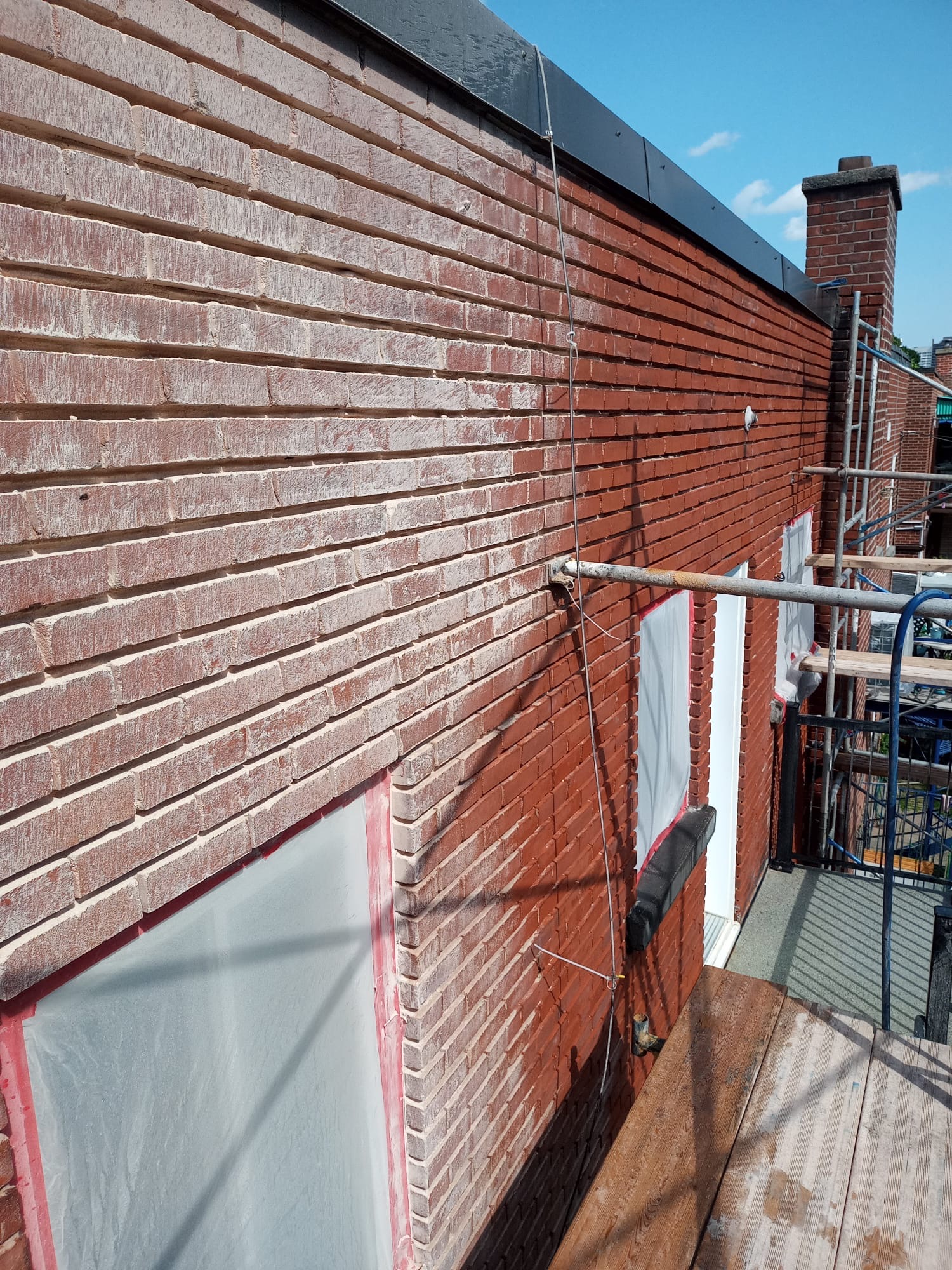 Brick repair and restoration on residential building in Montreal