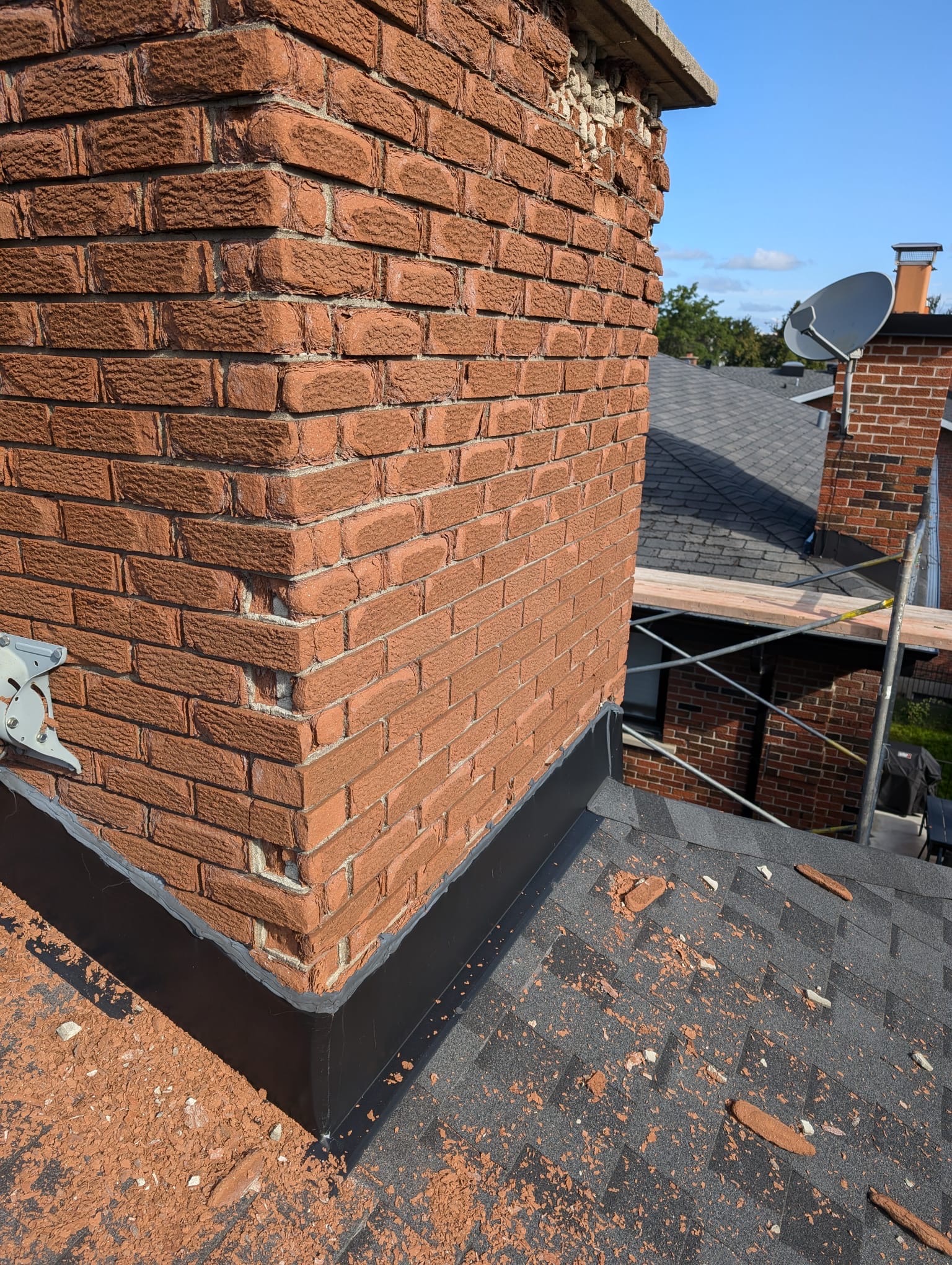 Brick chimney and facade damaged by freeze thaw cycles in Montreal