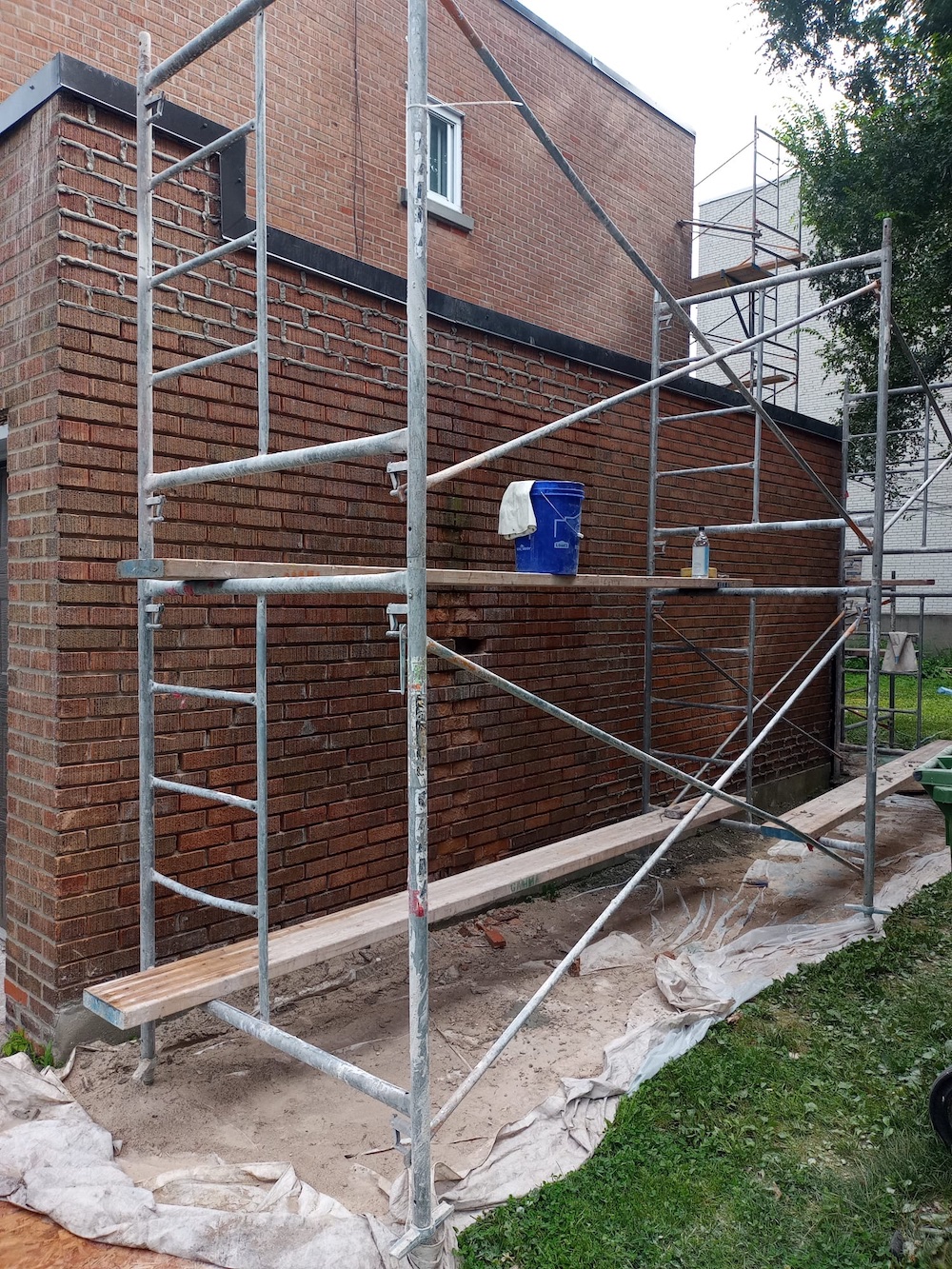 Residential brick repair project on Montreal home with masonry restoration work