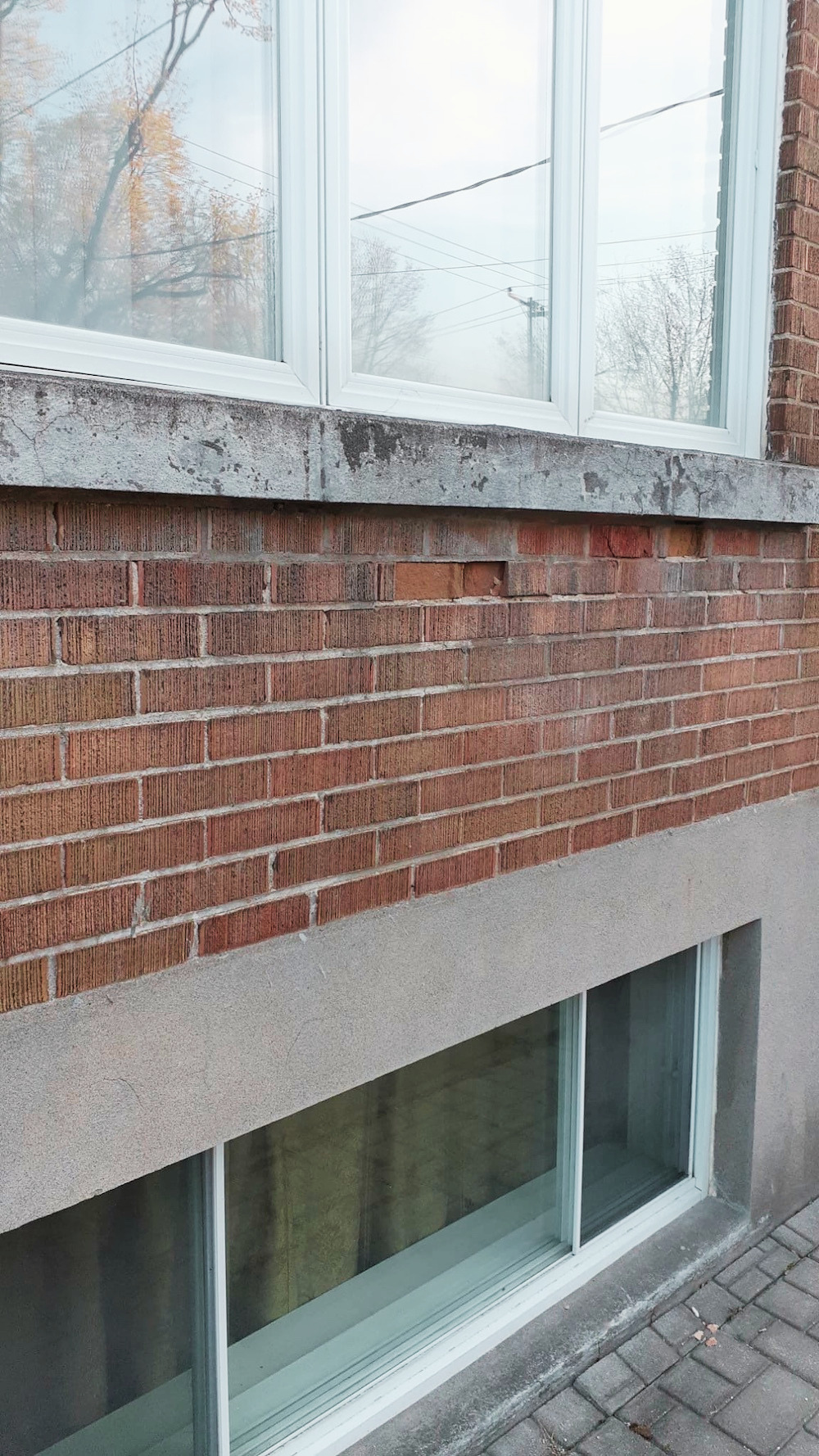 Protected brick wall and roofline designed to prevent water infiltration in Montreal