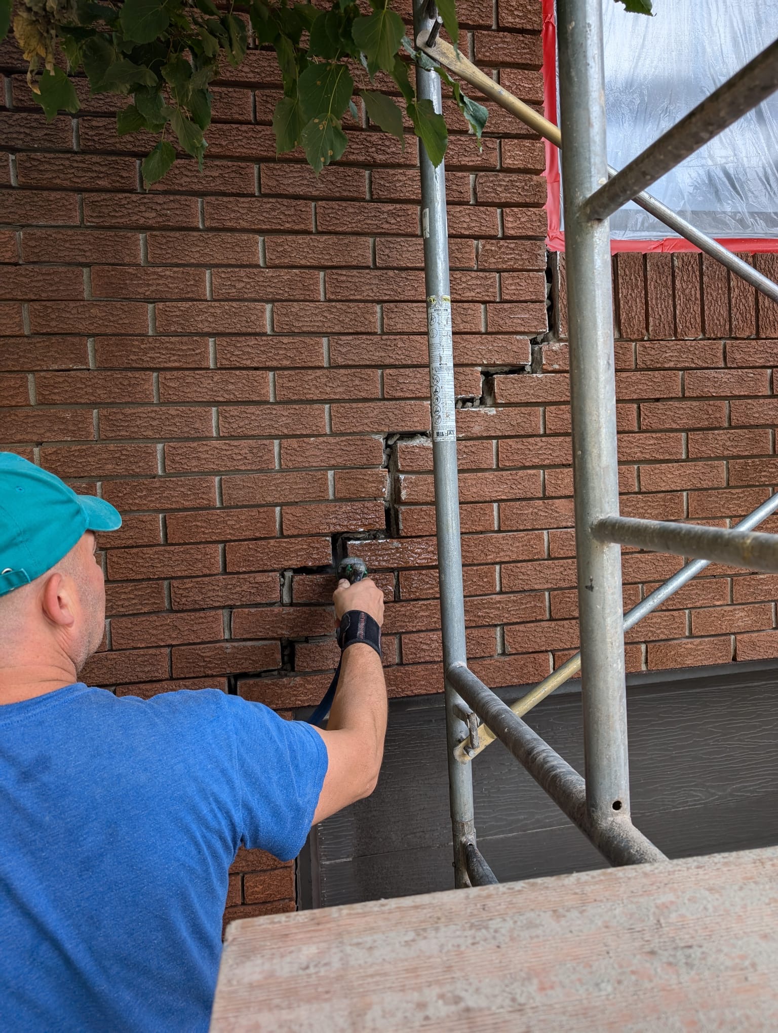 Restoration of old brick mortar joints on Montreal masonry facade