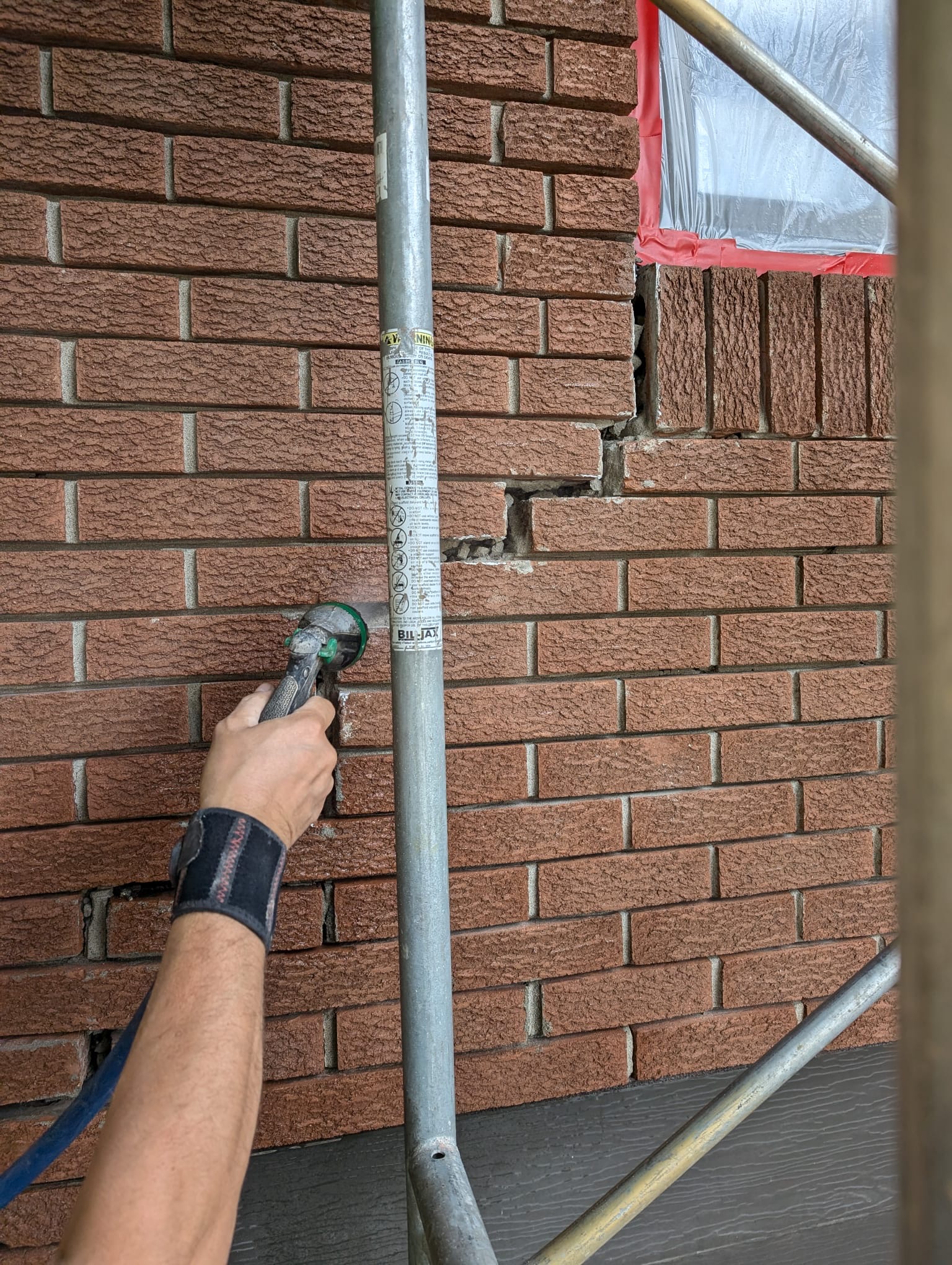 Deteriorating mortar joints between old brick masonry on Montreal building