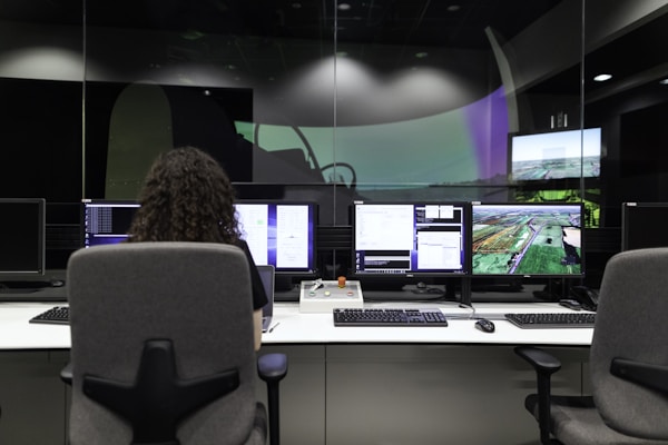 Female aerospace engineer monitors flight simulator