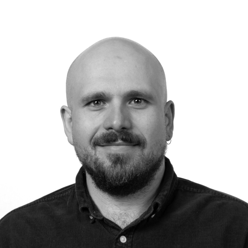 Black & white front headshot of Duncan Fogg