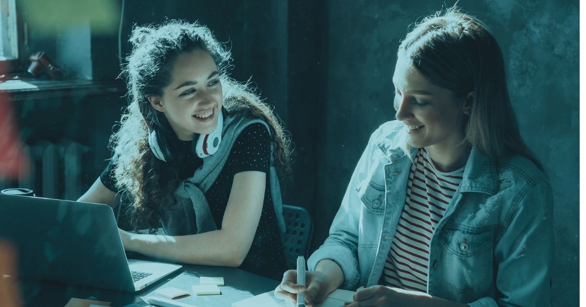 Two people at a desk