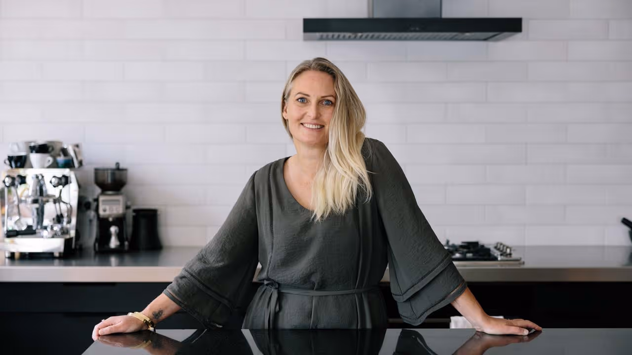 Erin in a modern kitchen. 