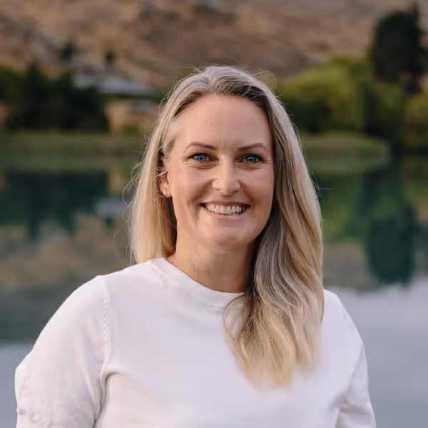 Headshot of Erin Whale in a white t-shirt.