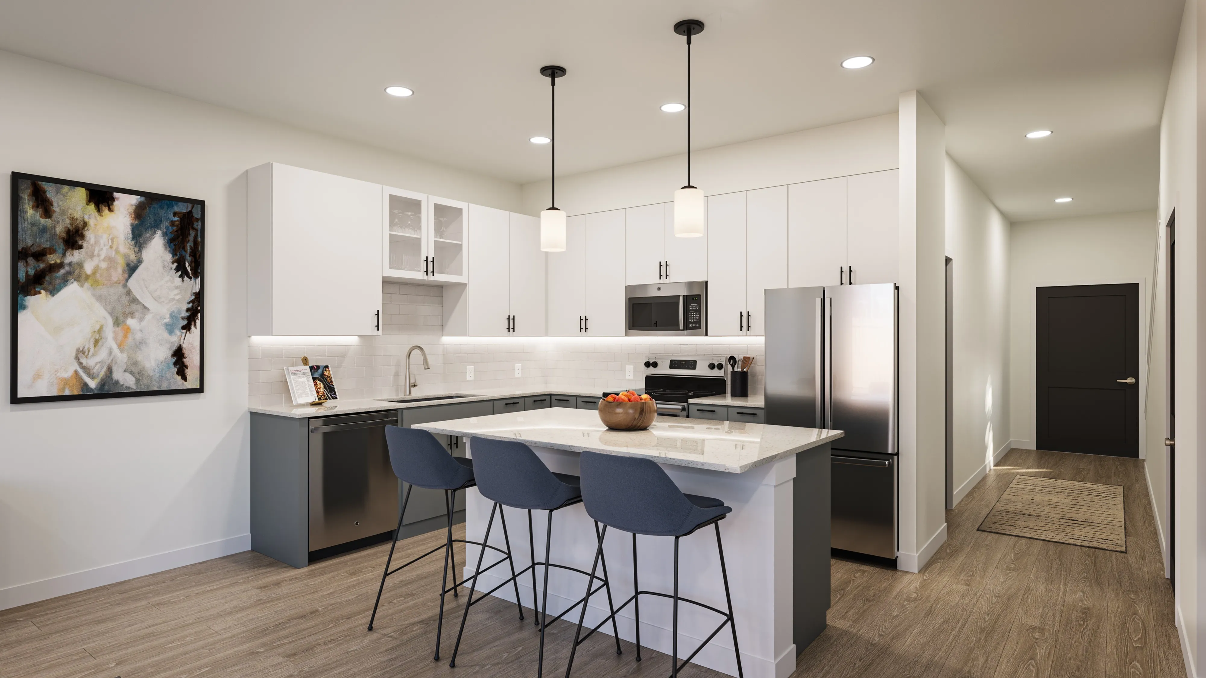 Modern kitchen with white and gray cabinets, a large island with three blue bar stools, stainless steel appliances, and pendant lights.