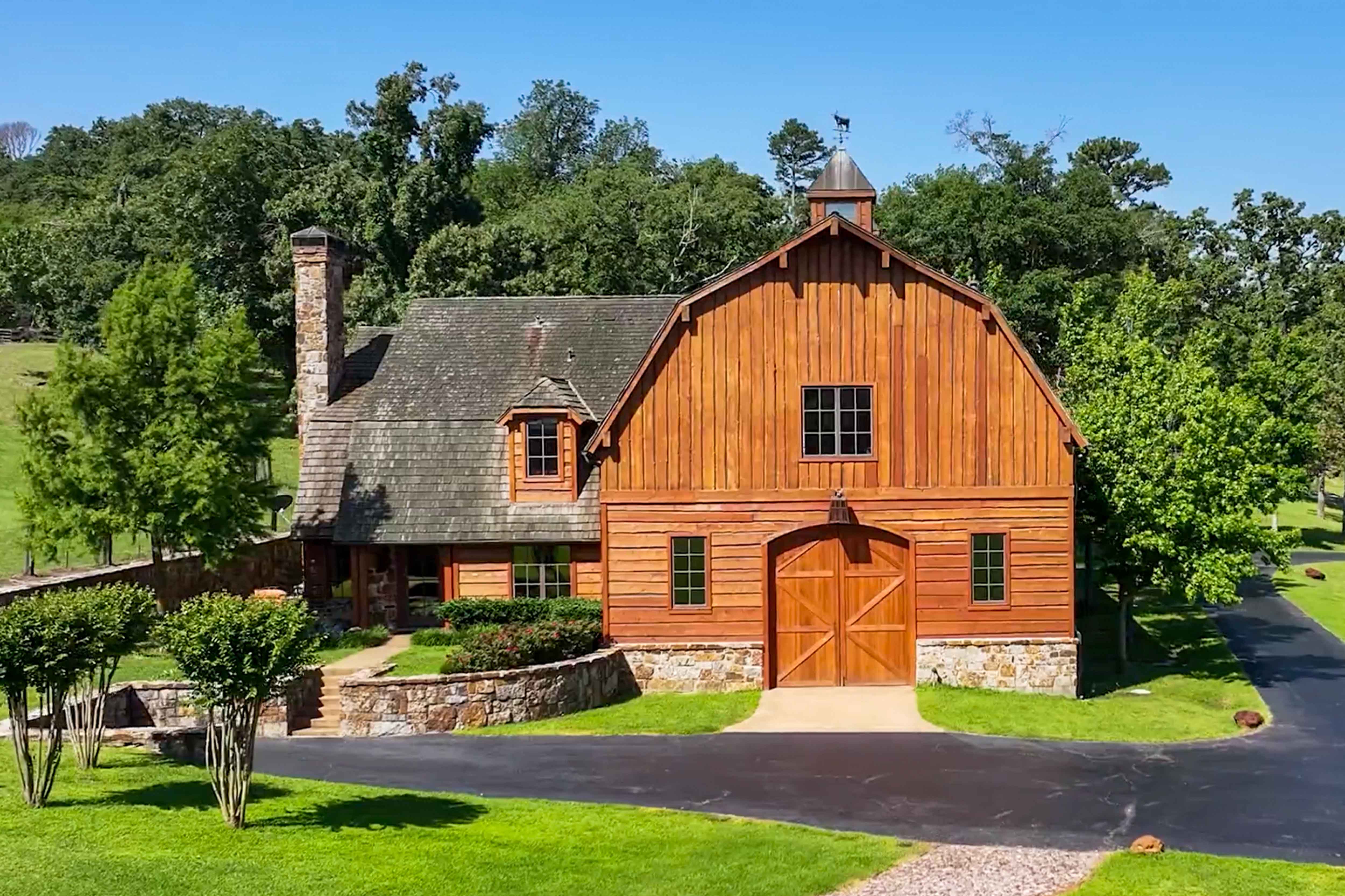 Timber Creek Ranch barn surrounded by green trees
