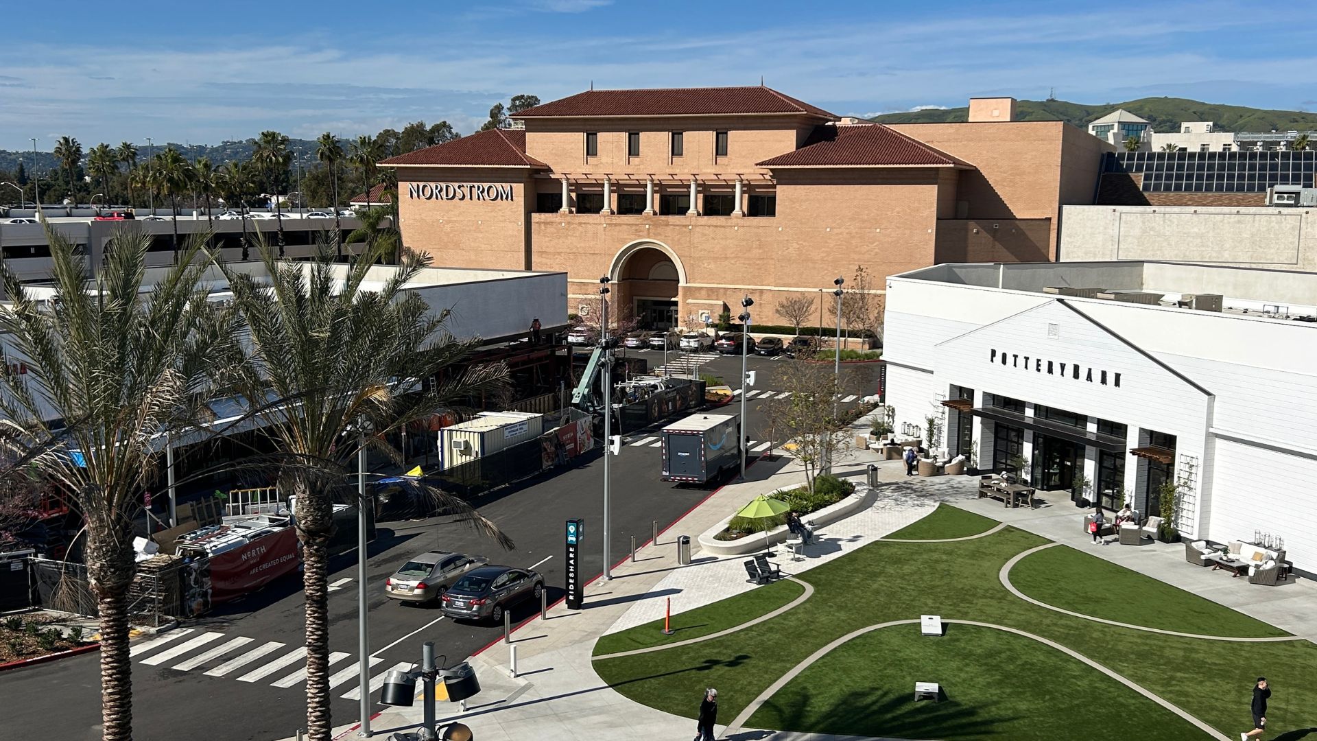 A photo of Brea Mall showing several buildings, with a freshly paved drive running between them