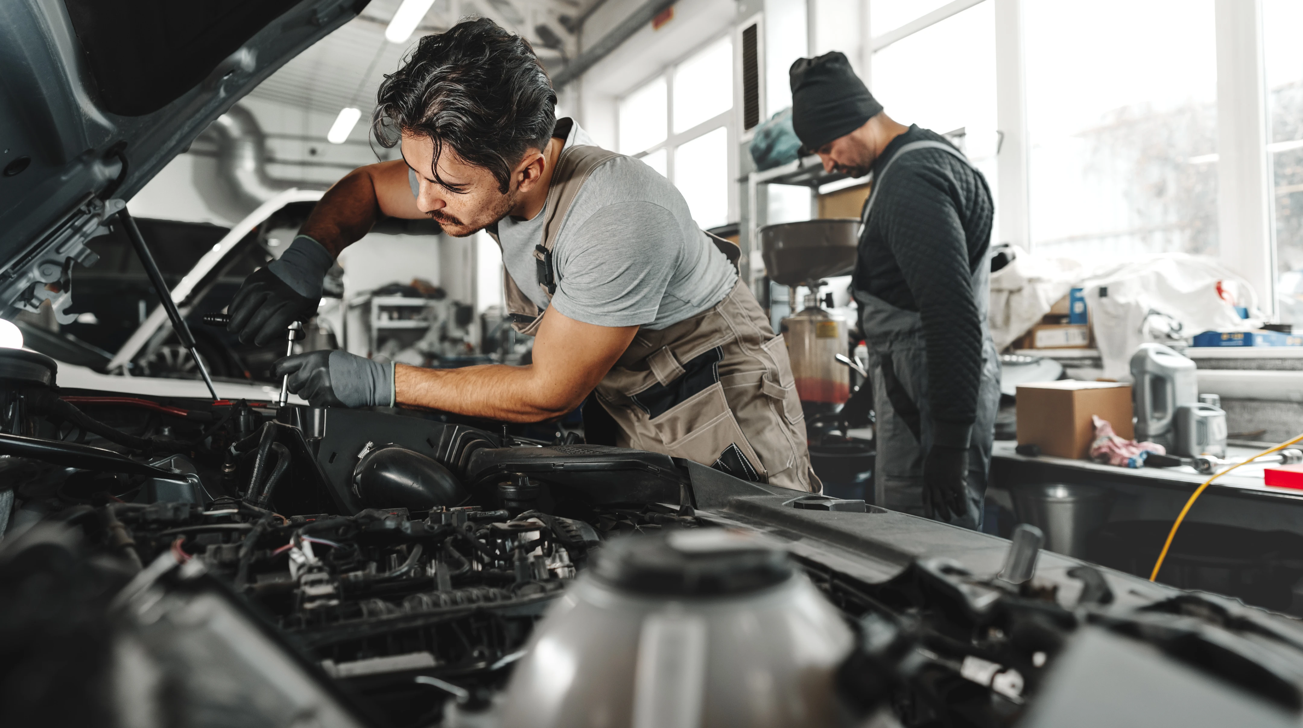 A person using a window cleaner to clean a large window, focused on removing dirt and streaks for a clear view.