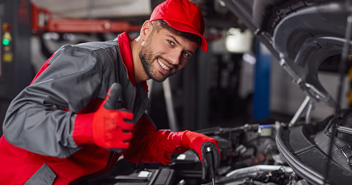 A person using a window cleaner to clean a large window, focused on removing dirt and streaks for a clear view.