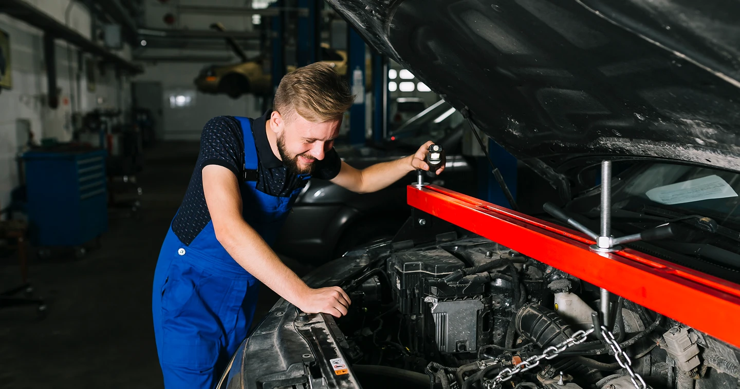 A person using a window cleaner to clean a large window, focused on removing dirt and streaks for a clear view.