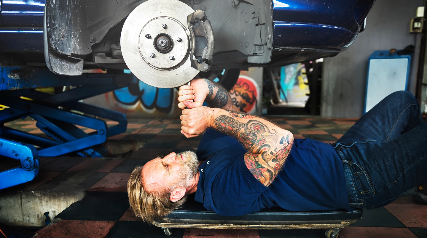 A person using a window cleaner to clean a large window, focused on removing dirt and streaks for a clear view.