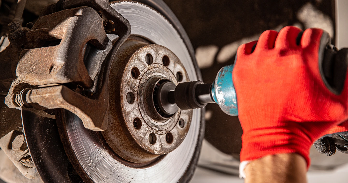 A person using a window cleaner to clean a large window, focused on removing dirt and streaks for a clear view.