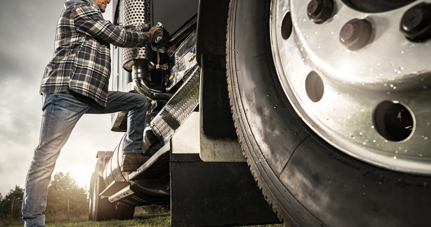 A person using a window cleaner to clean a large window, focused on removing dirt and streaks for a clear view.