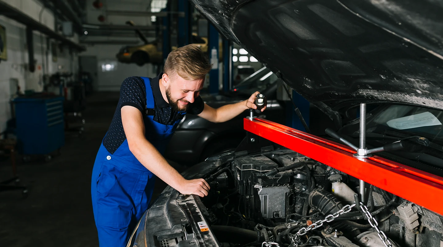 A person using a window cleaner to clean a large window, focused on removing dirt and streaks for a clear view.