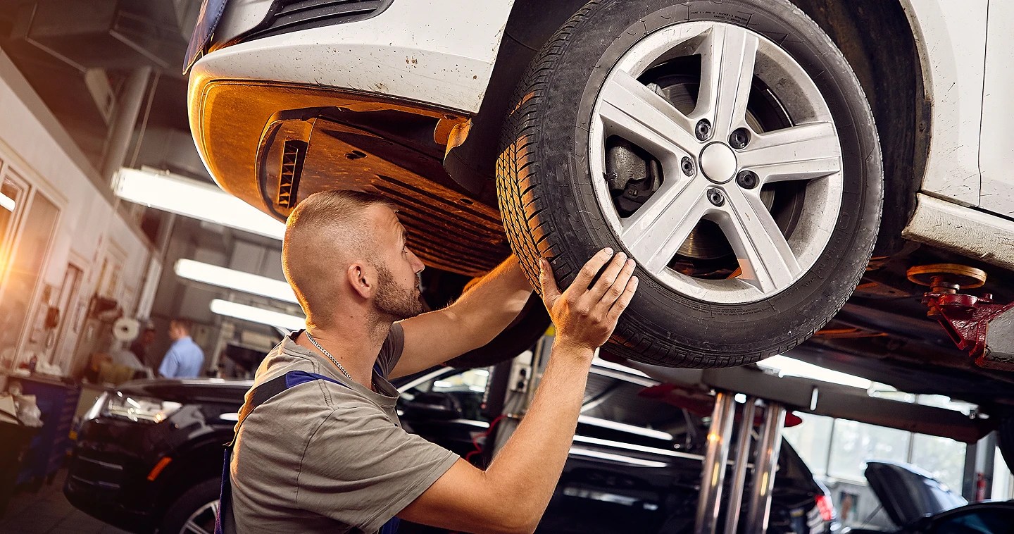 A person using a window cleaner to clean a large window, focused on removing dirt and streaks for a clear view.