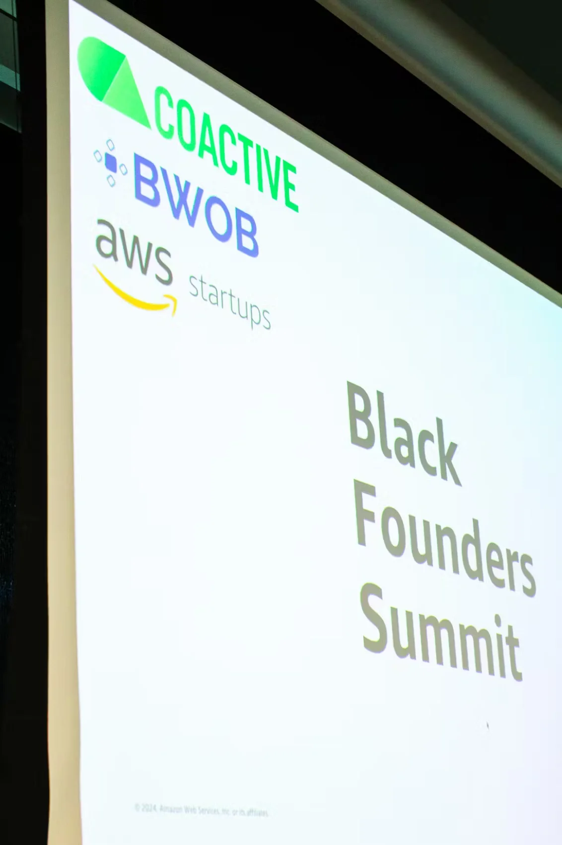 Coactive logo projected on a screen at the Black Founders Summit