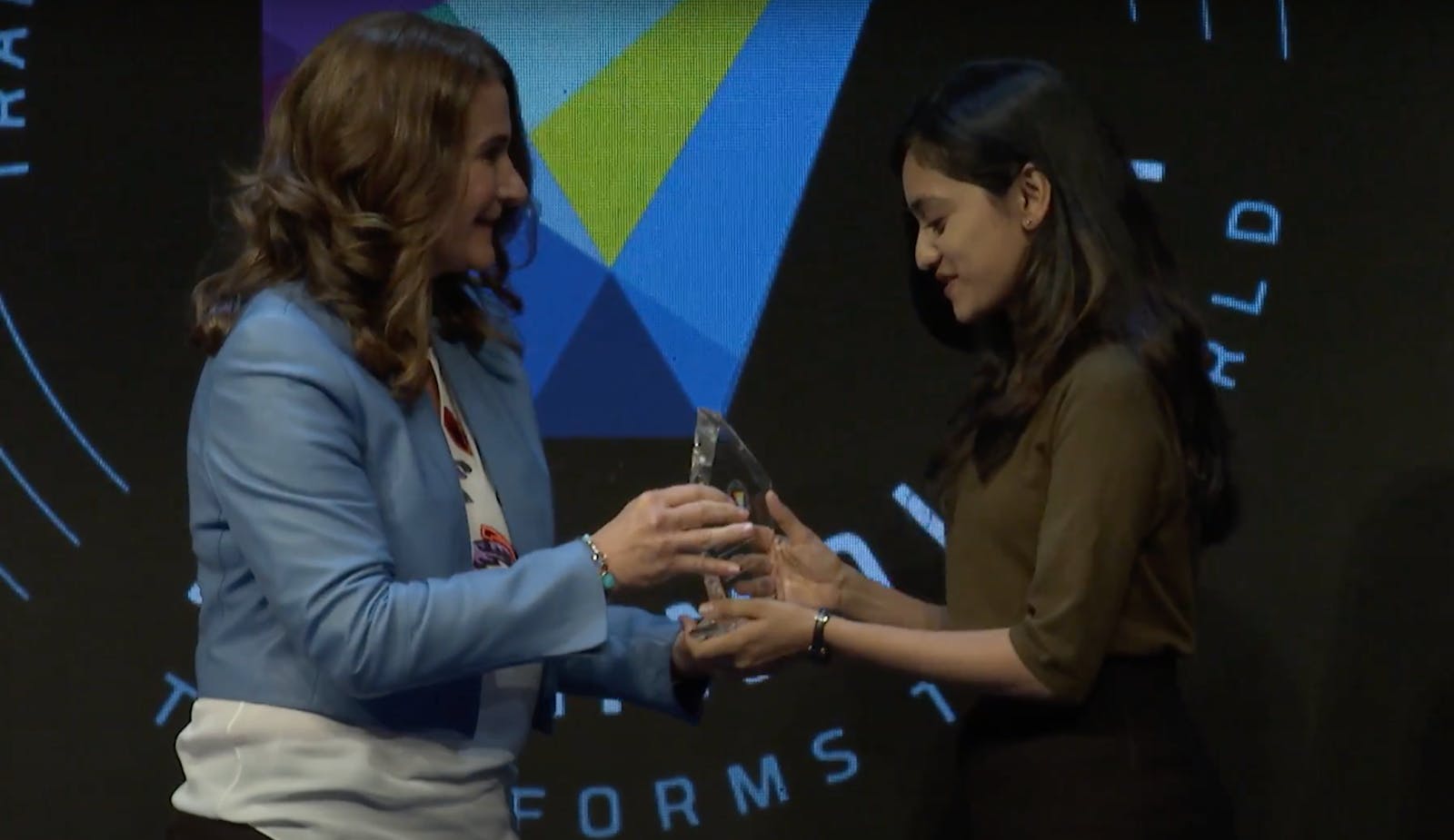 Mehul pictured with Melinda Gates, being awarded Student of Vision 2017 at Grace Hopper Celebration of Women in Computing.
