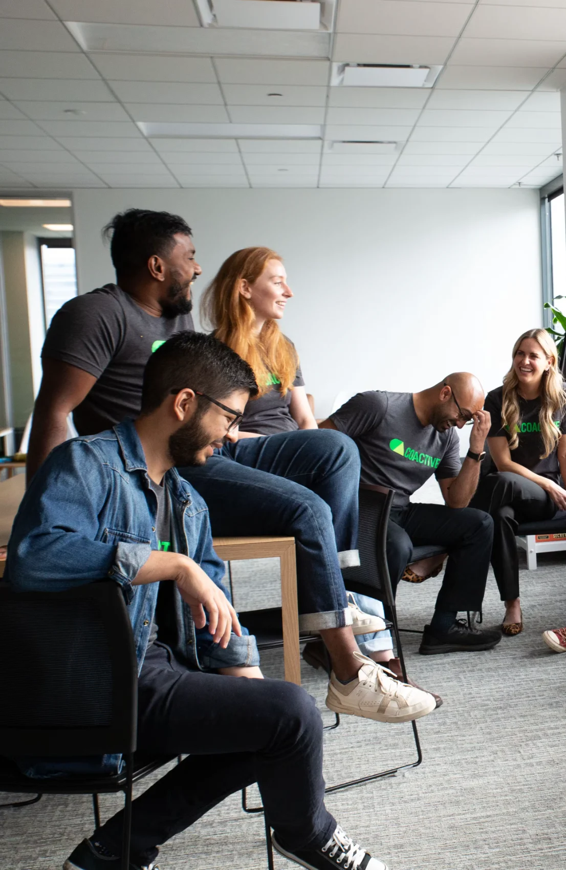 The Coactive team in the office - laughing at a joke.