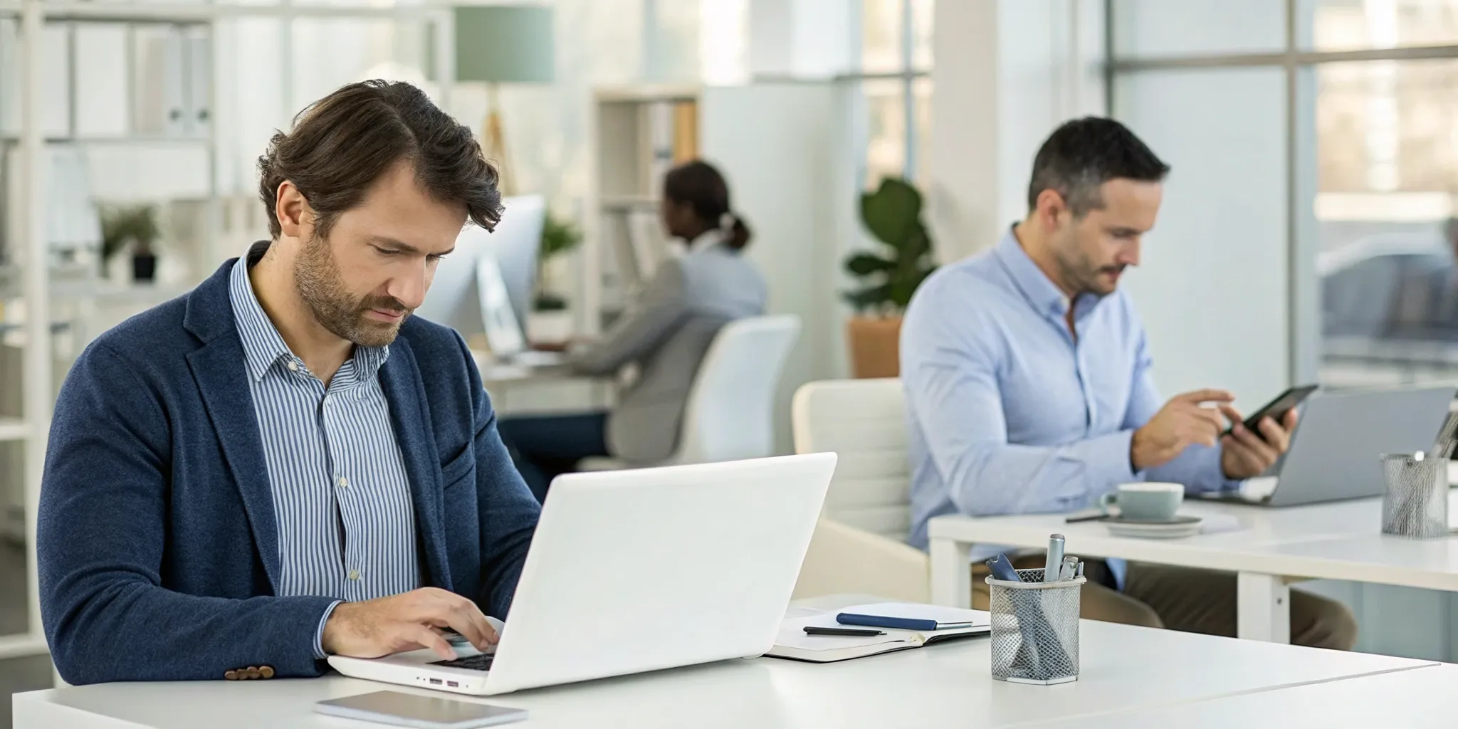 Office team using laptops for digital forms automation to simplify their workflow.