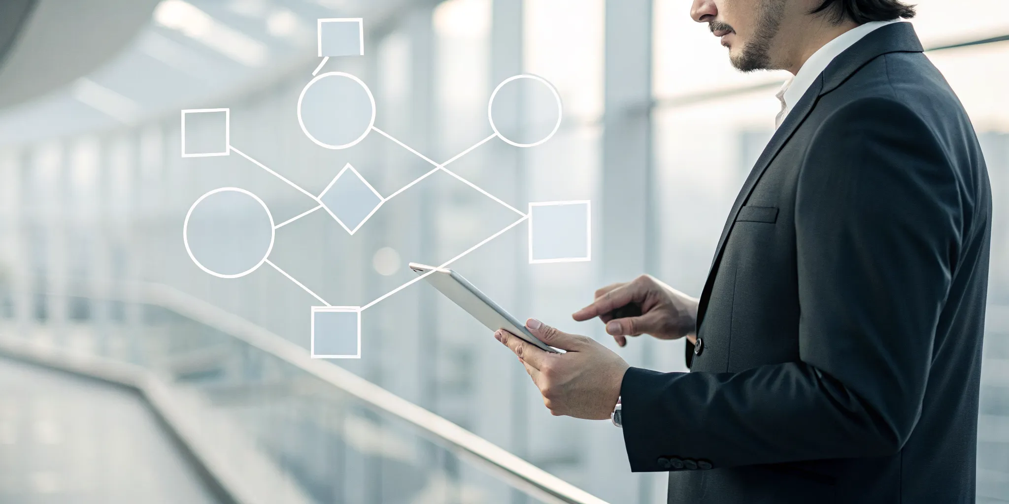 A designer mapping a business process on a tablet using a visual workflow designer.