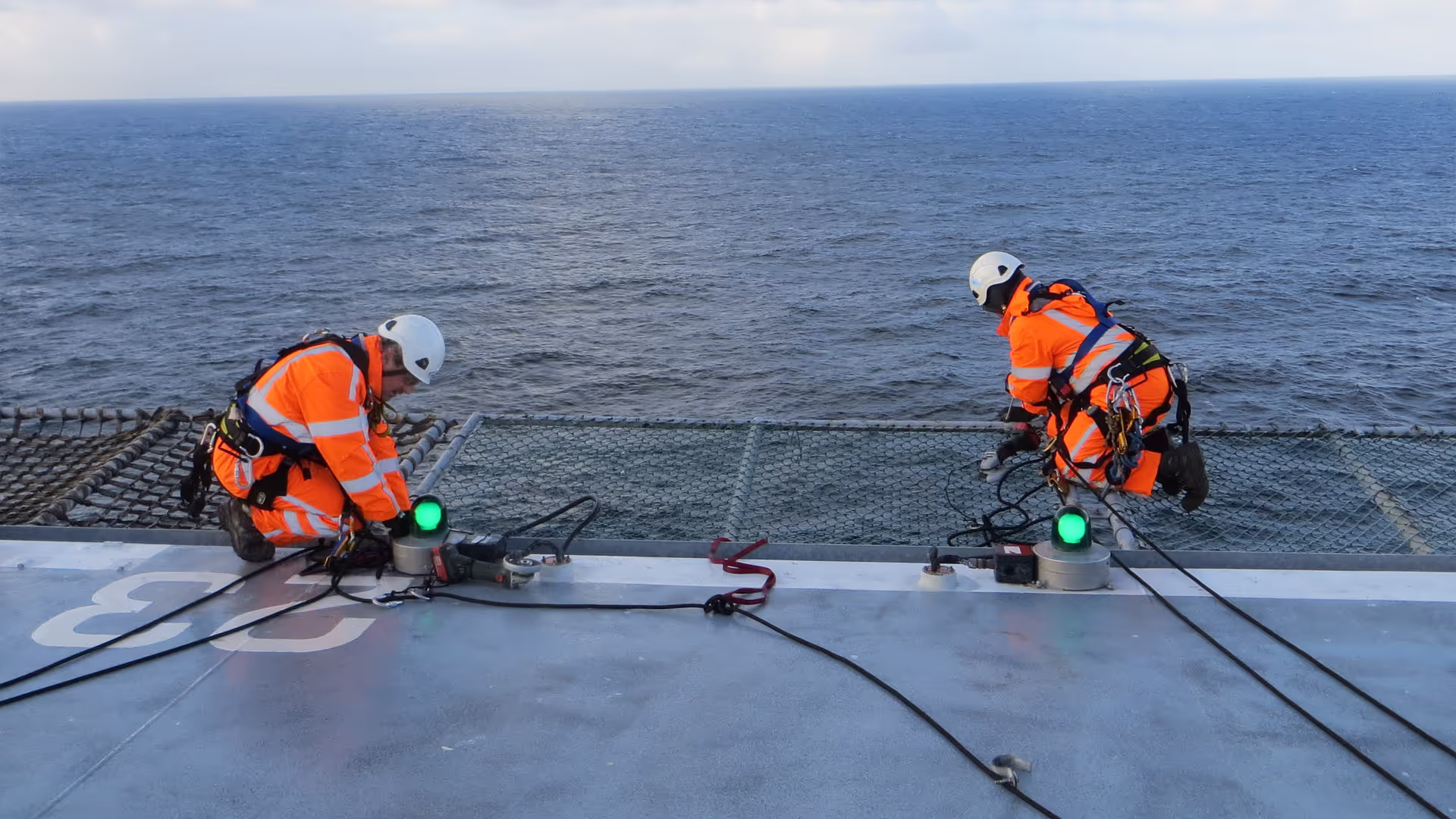 Conbit rope access technicians working on the netting installation 