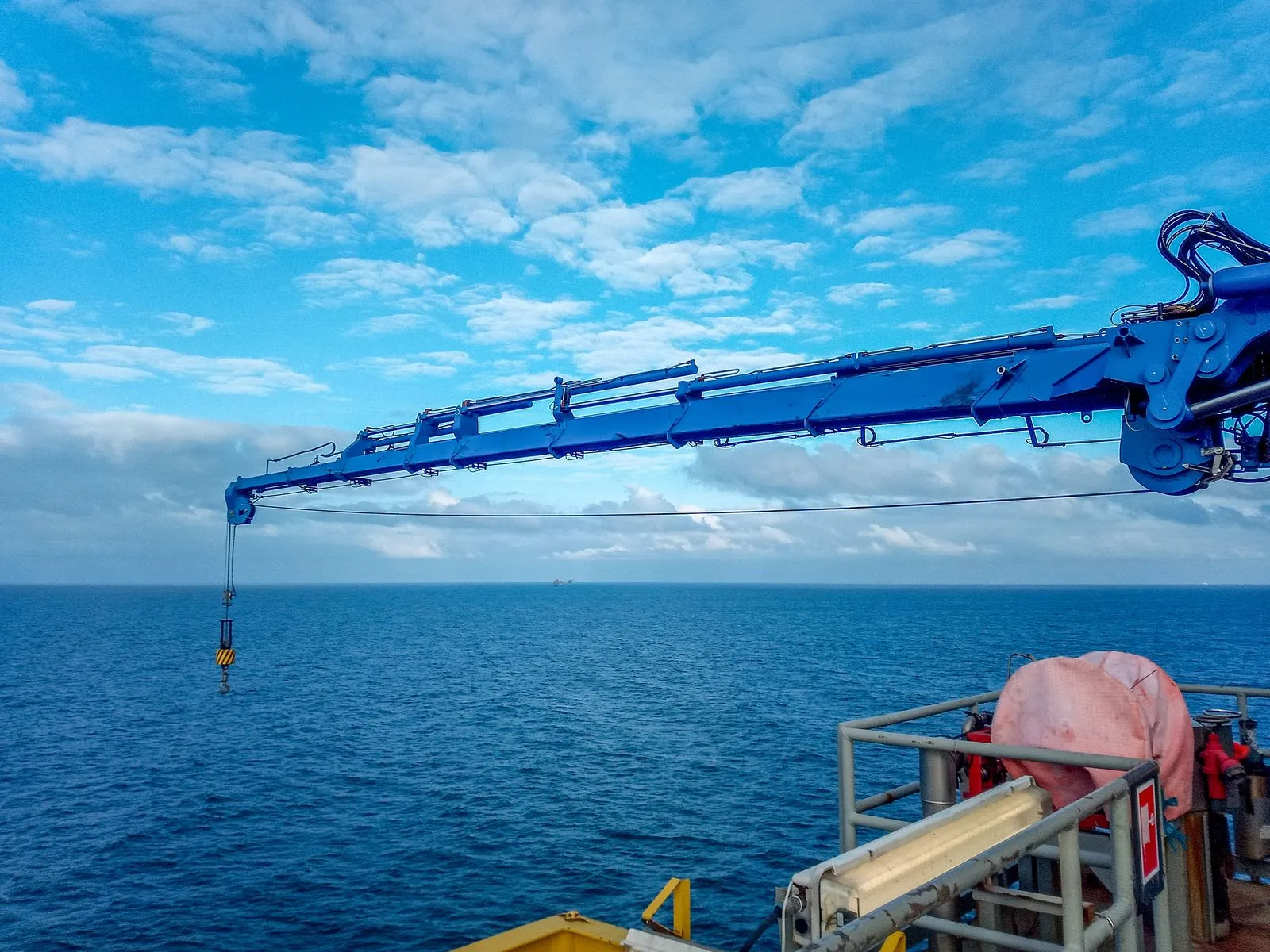 Knuckle Boom Crane being inspected before shipping